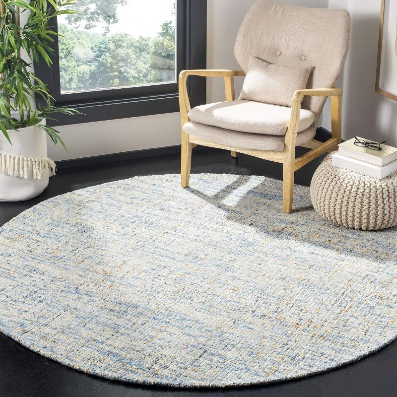 Photo 1 of SAFAVIEH Abstract Collection Area Rug - 8' Round, Dark Blue & Rust, Handmade Wool, Ideal for High Traffic Areas in Living Room, Bedroom
