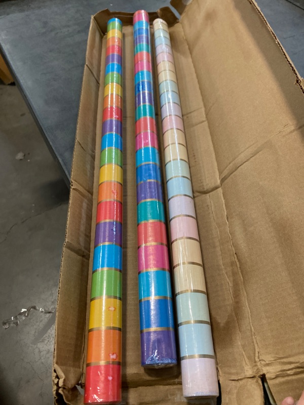 Photo 2 of Hallmark Reversible Rainbow Wrapping Paper (3 Rolls: 75 sq. ft. ttl) Pastel, Jewel Tone, Classic Stripes, Solid Pink, Blue, Red for Easter, Birthdays, Weddings, Bridal Showers, Baby, Back to School Rainbow Stripes