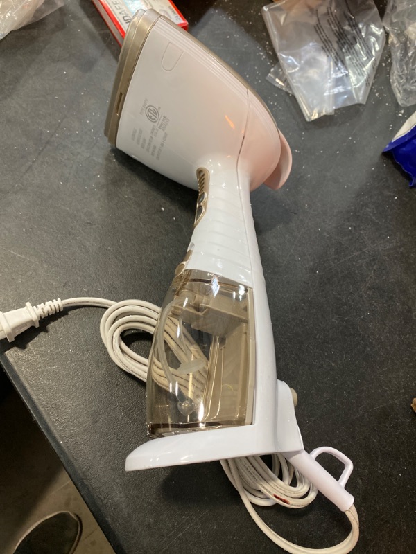 Photo 2 of Conair Handheld Garment Steamer for Clothes, Turbo ExtremeSteam 1875W, Portable Handheld Design, Strong Penetrating Steam, White / Champagne
