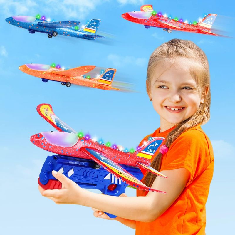 Photo 1 of Airplane Launcher Toys, Outdoor Flying Toys 2 Flight Modes LED Foam Glider Catapult Plane Toy for Boys Girls Kids Birthday Gifts Age 4 5 6 7 8 9 10 11 12+ Year Old