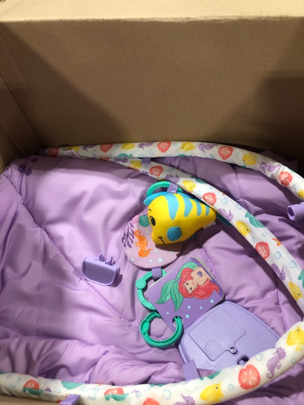 Photo 3 of Bright Starts The Little Mermaid Twinkle Trove Light-Up Musical Baby Activity Gym with Tummy Time Pillow, Newborn+