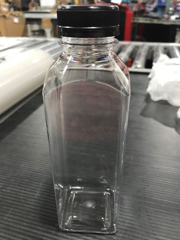 Photo 2 of 16 oz. Clear Food Grade Plastic Juice Bottle with Black Cap