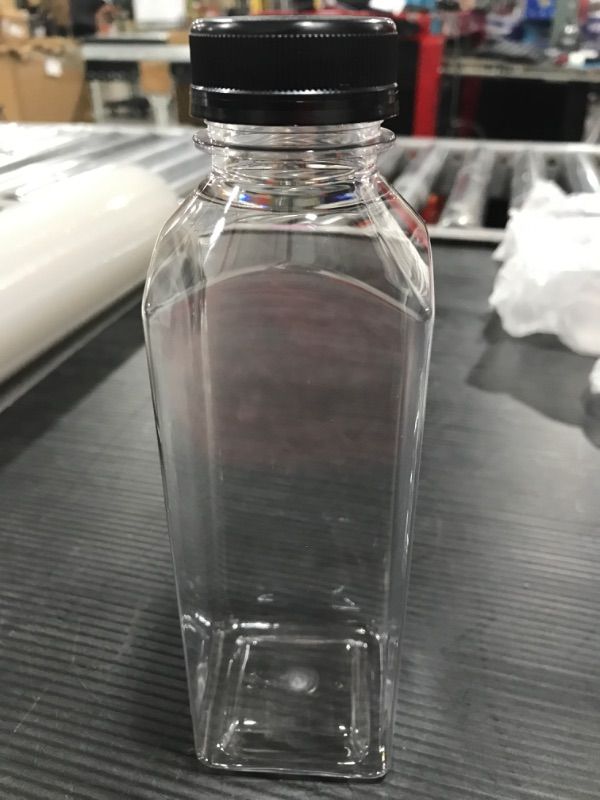 Photo 1 of 16 oz. Clear Food Grade Plastic Juice Bottle with Black Cap