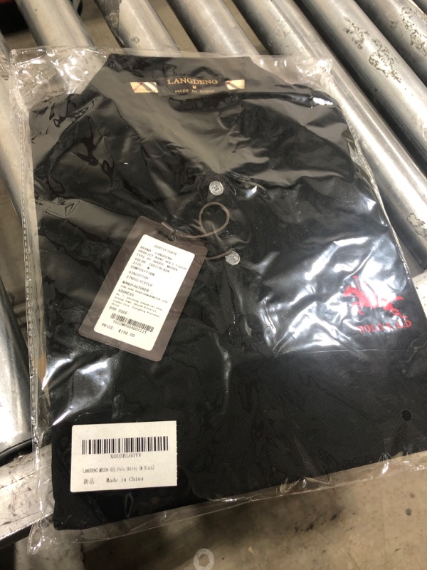 Photo 1 of BLACK POLO SHIRT WITH RED LETTERING SIZE MEDIUM 