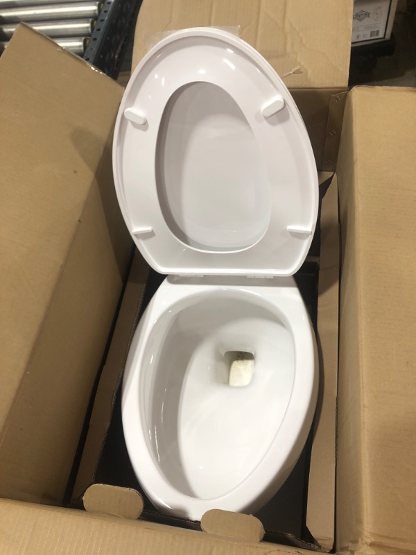 Photo 4 of 2-piece 1.1 GPF/1.6 GPF High Efficiency Dual Flush Complete Elongated Toilet in White, Seat Included
