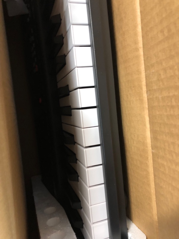 Photo 4 of Amazon Basics Portable Digital Piano Keyboard with 61 Keys, Built In Speakers and Songs