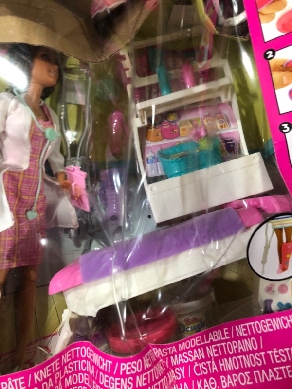 Photo 1 of Barbie Fast Cast Clinic Playset, Brunette Doctor Doll (12-in), 30+ Play Pieces, 4 Play Areas, Cast & Bandage Making, Medical & X-ray Stations, Exam Table, Gift Shop & More, Great Toy Gift