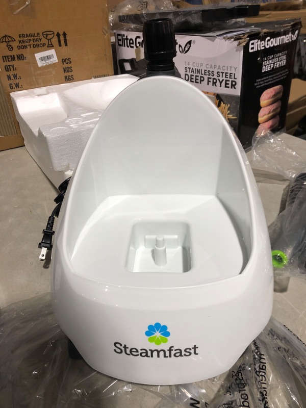 Photo 2 of * important * see clerk notes * 
Steamfast SF-520 Full Size Fabric Steamer with Insulated Hose, Clothes Hanger, and Fabric Brush , White