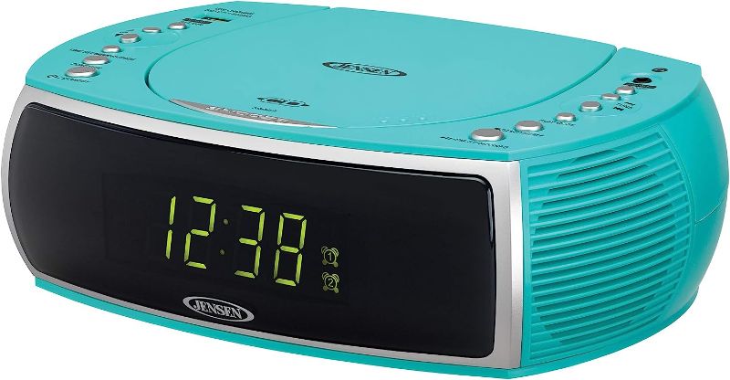 Photo 1 of Jensen Turquoise Modern Home CD Tabletop Stereo Clock Digital AM/FM Radio CD Player Dual Alarm Clock Stereo CD Top-Loading Disc Player | USB Charging Port DV 5V 800mA | Headphone Jack | 0.9 Display
UNABLE TO TEST - BATTERIES NOT INCLUDED