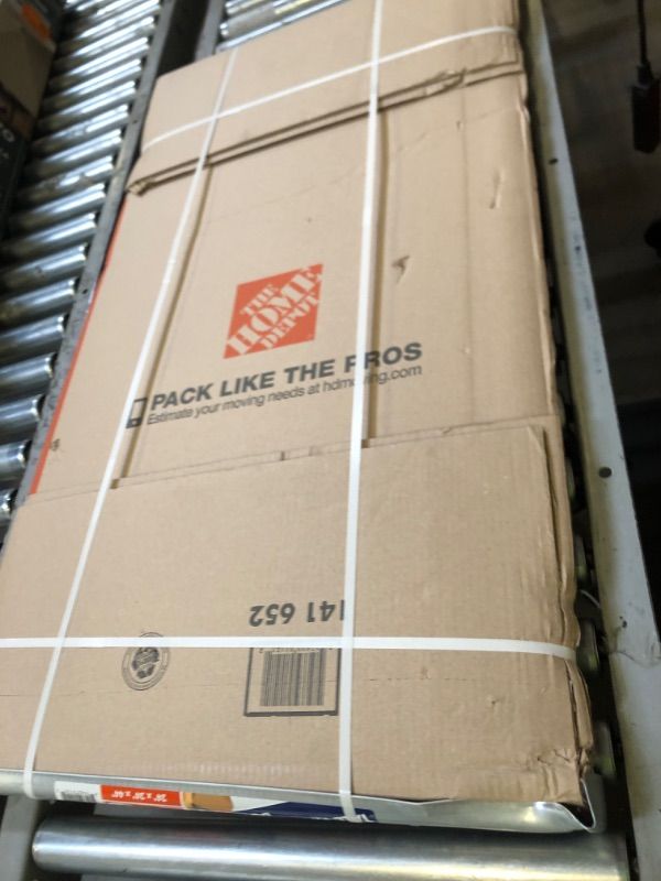 Photo 1 of Heavy-Duty Tall Wardrobe Moving Box with Metal Hanging Bar and Handles (24 in. L x 24 in. W x 44 in. D)