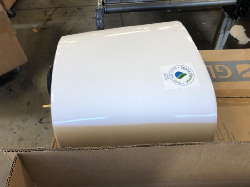 Photo 3 of 2-piece 1.1 GPF/1.6 GPF High Efficiency Dual Flush Complete Elongated Toilet in White, Seat Included HAS SOME CRACKS ON THE SIDE OF TOP TANK PART  