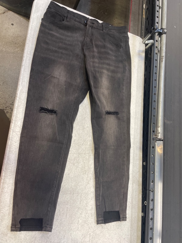 Photo 1 of FADED JEANS WITH DISTRESSED KNEES 31