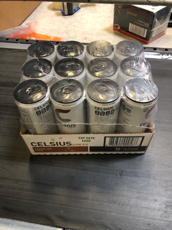 Photo 2 of CELSIUS Sparkling Cola, Functional Essential Energy Drink 12 Fl Oz (Pack of 12) Sparkling Cola 12 Fl Oz (Pack of 12) EXP DEC 2022