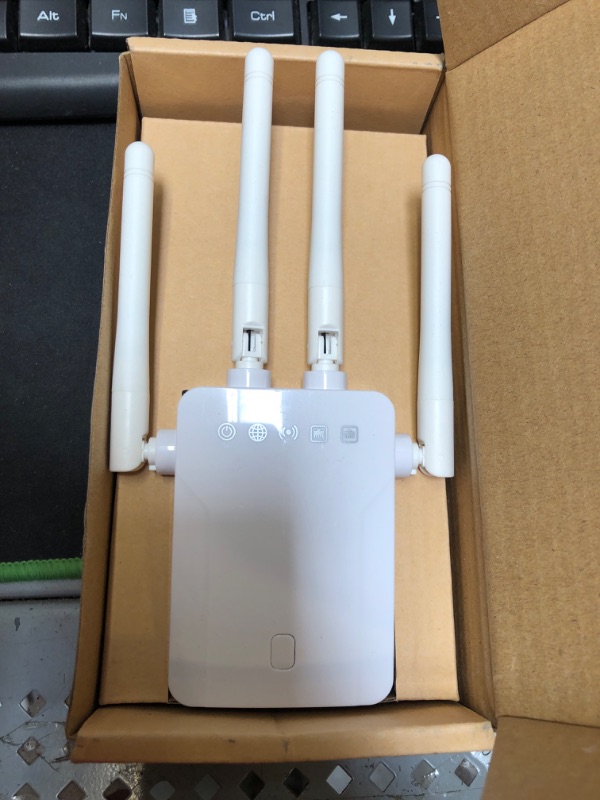 Photo 2 of WiFi Repeater - WiFi Booster,Signal Extender,Coverage Up to 2500 sq.ft,1200 Mbps 2.4 & 5GHz Wireless Internet Amplifier - Covers 20 Devices with 4 External Advanced Antennas.
