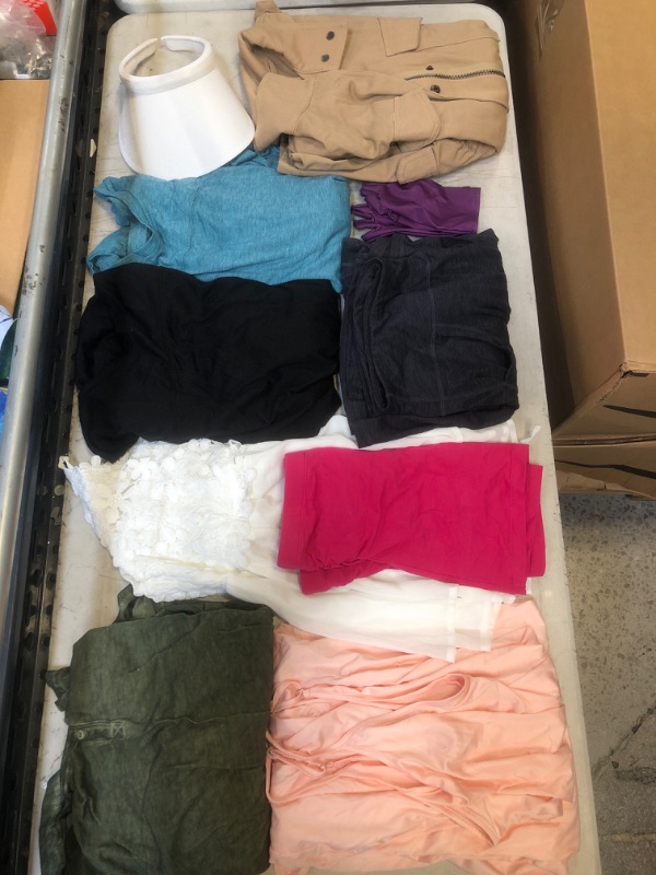 Photo 1 of MISCELLANEOUS BAG LOT - VARIOUS WOMENS CLOTHES - NEW AND USED CLOTHING - SOLD AS IS