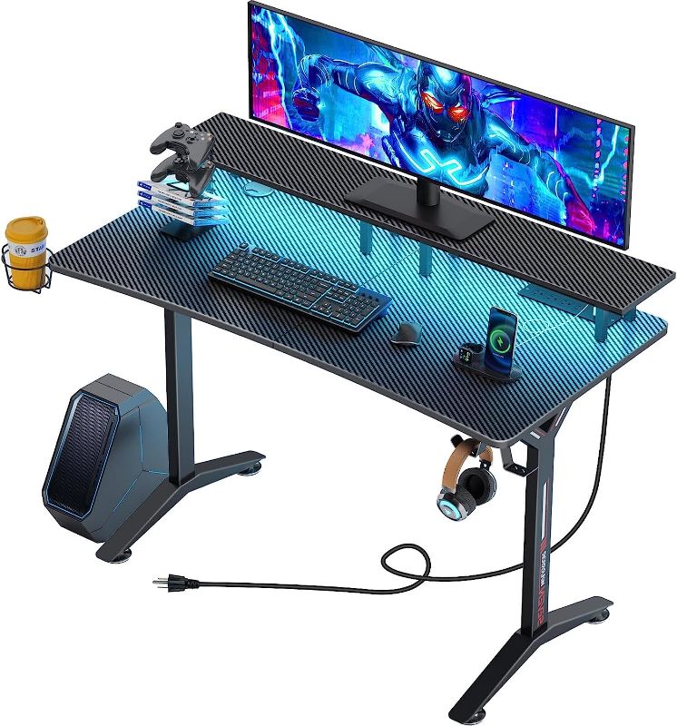 Photo 1 of SEVEN WARRIOR Gaming Desk 60" with LED Lights & Power Outlets, Computer Desk with Full Desk Mouse Pad, Ergonomic Office Desk with Monitor Stand, Carbon Fiber Surface Black

