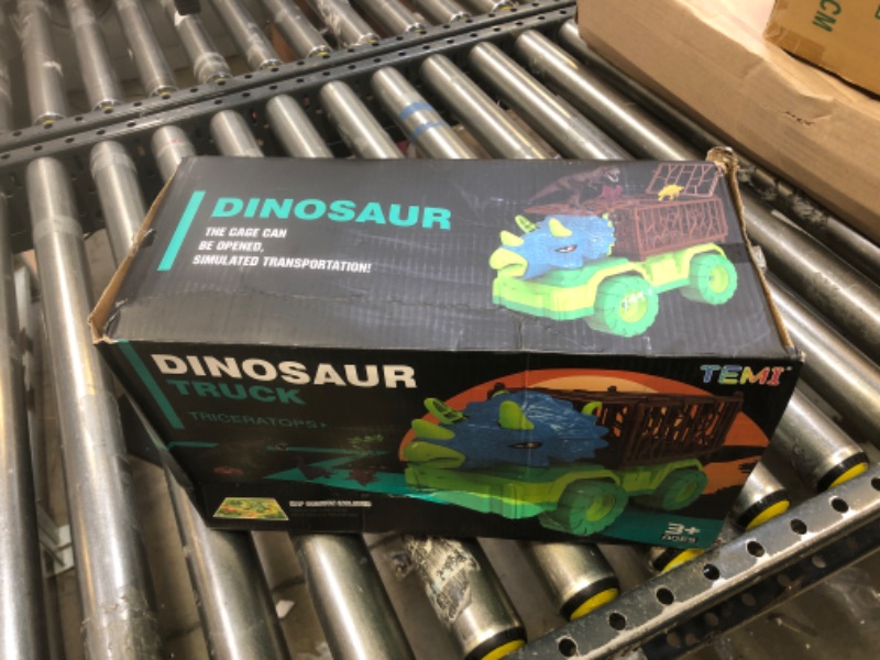 Photo 2 of TEMI Dinosaur Truck Toys for Kids 3-5 Years, Tyrannosaurus Transport Car Carrier Truck with 8 Dino Figures, Activity Play Mat, Dinosaur Eggs, Capture Jurassic Dinosaur Play Set for Boys and Girls Tyrannosaurus Dino Truck