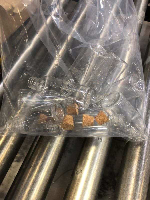 Photo 1 of 10 Pack Plastic Sand Art Bottles with Cork Stoppers 2oz Clear Art Containers Plastic Jars with Cork Mini Vial Potion Bottles for DIY Wedding Party Favors Wish Message Bottle
