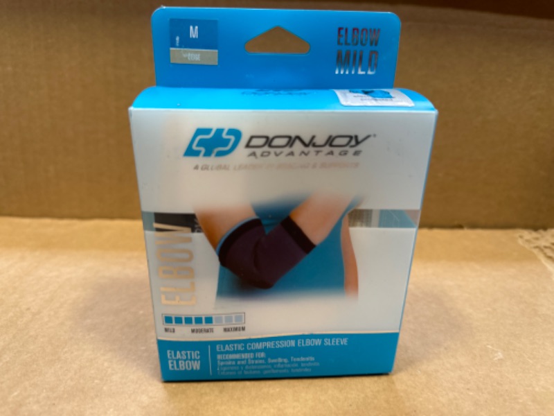 Photo 2 of DonJoy Advantage DA161ES01-TAN-M Elastic Elbow Sleeve for Strains, Sprains, Swelling, Panels for Free Movement, Tan, Medium fits 9", 10.5" Medium fits 9"-10.5"