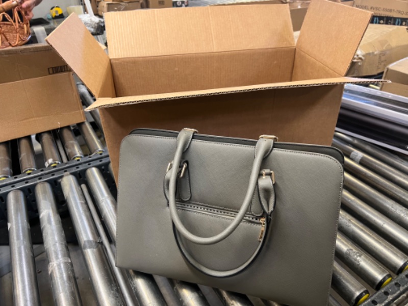 Photo 1 of gray handbag with smaller bag