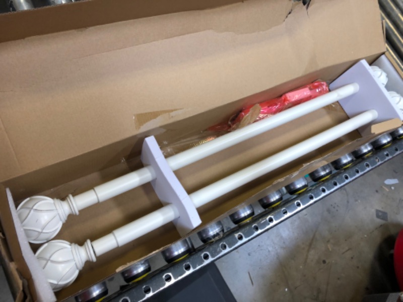 Photo 1 of 28"x48" curtain rods 