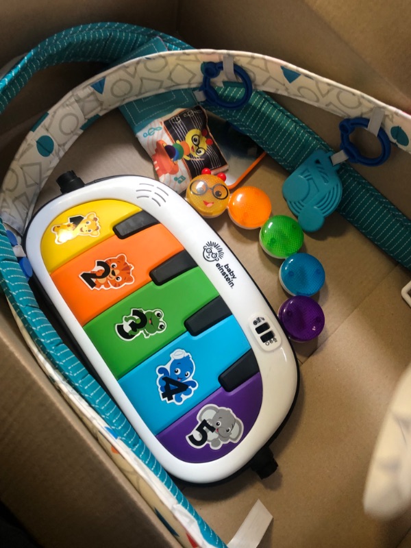 Photo 1 of Baby Einstein 4-in-1 Kickin' Tunes Music and Language Play Gym and Piano Tummy Time Activity Mat ---- MISSING PILLOW AND SOME TOY ACCESSORIES 
