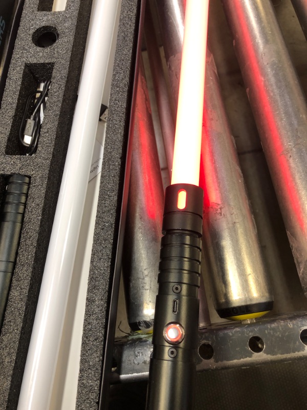 Photo 4 of Kiseely Lightsaber, 15 Colors Light Sabers with Vibrating Metal Hilts, 2 in 1 LED Light Sword with 3 Sounds Mode, Metal Hilts | Light Burst Mode | Rechargeable Battery (Black)\
ONE BROKEN THE OTHER ONE STILL WORKS****************