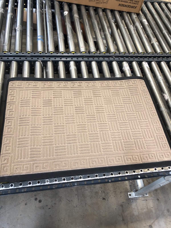 Photo 1 of 35"x23",tan and black door mat