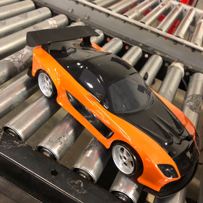 Photo 3 of Jada Toys Fast & Furious Han’s Mazda RX-7 Drift RC Car, 1: 10 Scale 2.4Ghz Remote Control Orange & Black, Ready to Run, USB Charging (Standard) (99700)
