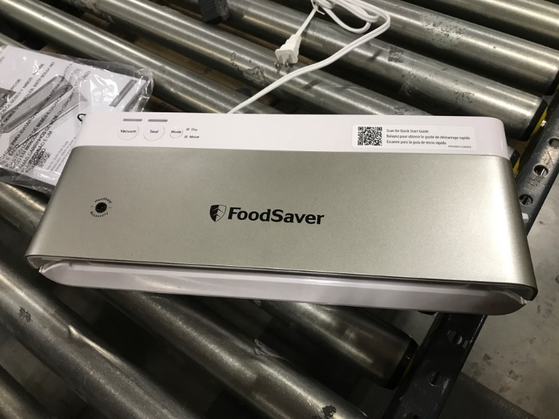 Photo 2 of FoodSaver Compact Vacuum Sealer Machine with Sealer Bags and Roll for Airtight Food Storage and Sous Vide, White
