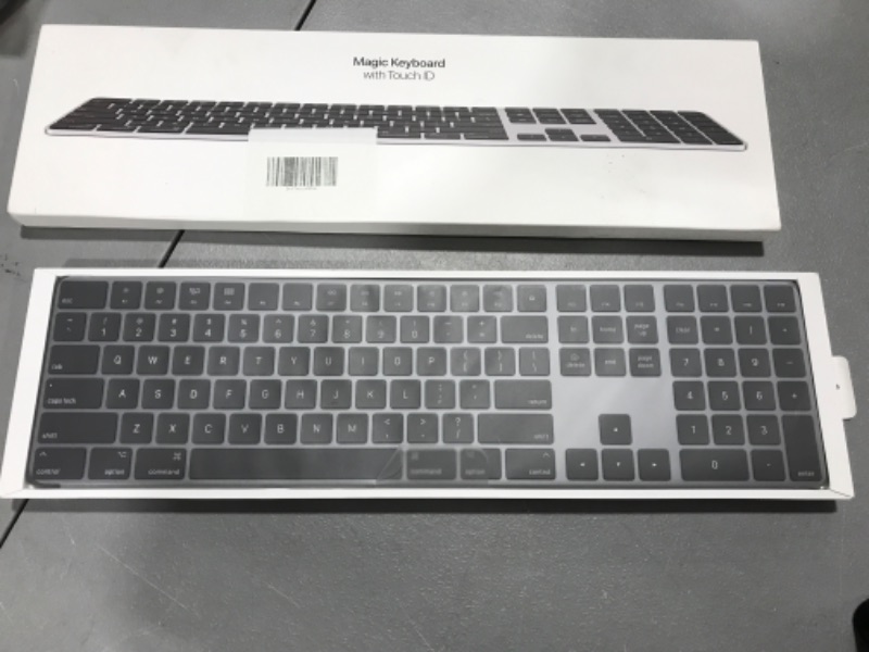 Photo 2 of Apple Magic Keyboard with Touch ID and Numeric Keypad: Wireless, Bluetooth, Rechargeable. Works with Mac Computers Silicon; German, Black Keys