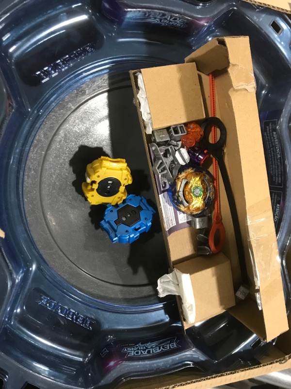 Photo 2 of BEYBLADE Burst Pro Series Evo Elite Champions Pro Set -- Complete Battle Game Set with Beystadium, 2 Battling Top Toys and 2 Launchers Frustration-Free Packaging