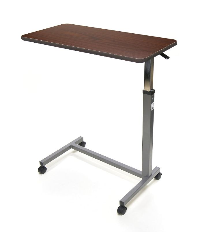 Photo 1 of Invacare 6417 Hospital Style Overbed Table with Auto-Touch Adjustable Height and Wheel for Beds and Bedside, Brown, 0.75" Height, 15" Width, 30" Length
