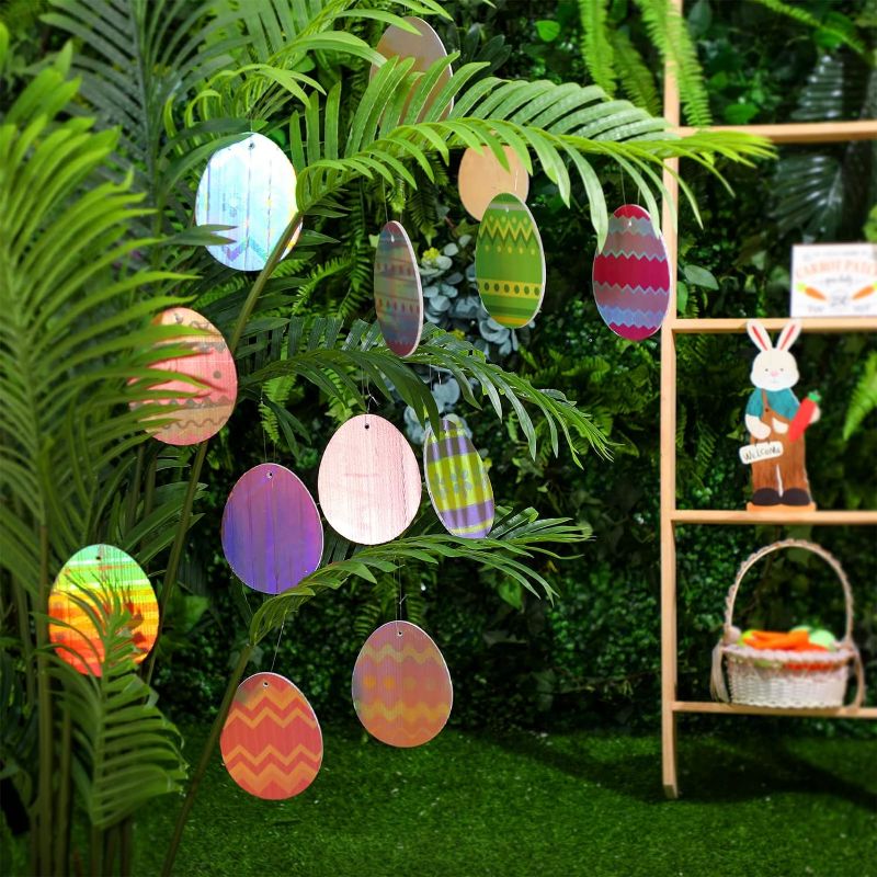 Photo 1 of 16 Pcs Easter Eggs Ornaments Reflective Outdoor Decorations Easter Tree Hanging Ornament Colorful Floral Stripes Egg Signs for Yard Lawn Porch Tree Decor Party