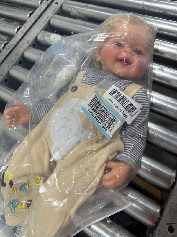 Photo 2 of TERABITHIA 22 Inches Rooted Blond Curly Hair Lifelike Reborn Baby Doll Crafted in Silicone Vinyl Full Body Anatomically Correct Newborn Realistic Smiling Toddler Boy Dolls with Teeth Look Real Light Brown