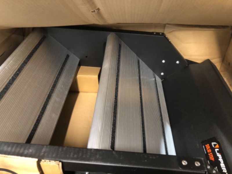 Photo 1 of Lippert Components 733931 Solid Step Quad Step for RV and Travel Trailer Entry Doorway Black, 26-inch 