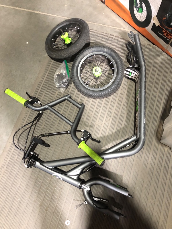 Photo 2 of **MINOR DAMAGE**
Mongoose Expo Youth Scooter, Front and Rear Caliper Brakes, Rear Axle Pegs, 12-Inch Inflatable Wheels Green/Grey