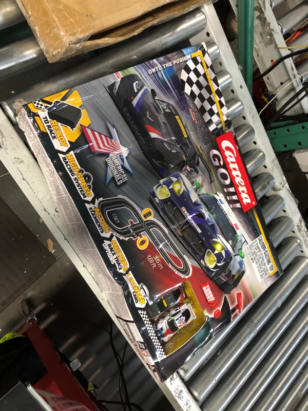 Photo 2 of Carrera GO!!! 62521 onto The Podium Electric Powered Slot Car Racing Kids Toy Race Track Set Includes 2 Hand Controllers and 2 Cars in 1:43 Scale