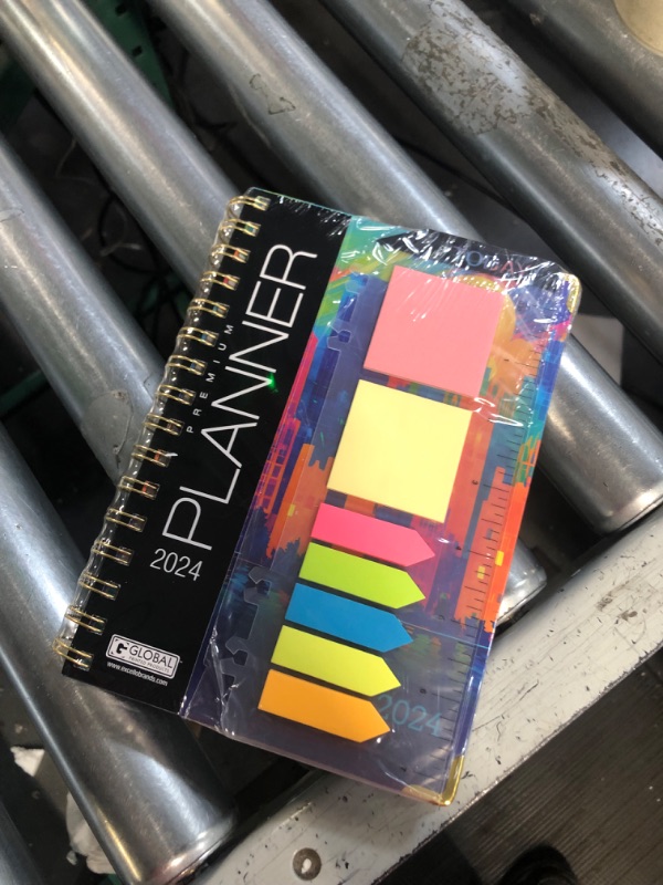 Photo 1 of HARDCOVER 2024 Planner: (November 2023 Through December 2024) 5.5"x8" Daily Weekly Monthly Planner Yearly Agenda (Rainbow Cityscape)
