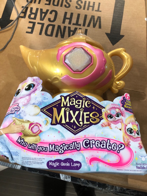 Photo 2 of Magic Mixies Magic Genie Lamp with Interactive 8" Pink Plush Toy and 60+ Sounds & Reactions. Unlock a Magic Ring and Reveal a Pink Genie from The Real Misting Lamp. Gifts for Kids, Ages 5+, Medium