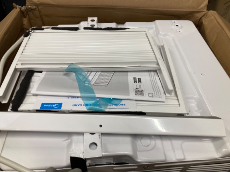 Photo 1 of Midea 12000 BTU Smart Inverter Air Conditioner Window Unit with Heat and Dehumidifier – Cools up to 550 Sq. Ft., Energy Star Rated, Quiet Operation, Electronic Controls, Remote Control, White 12,000 BTU