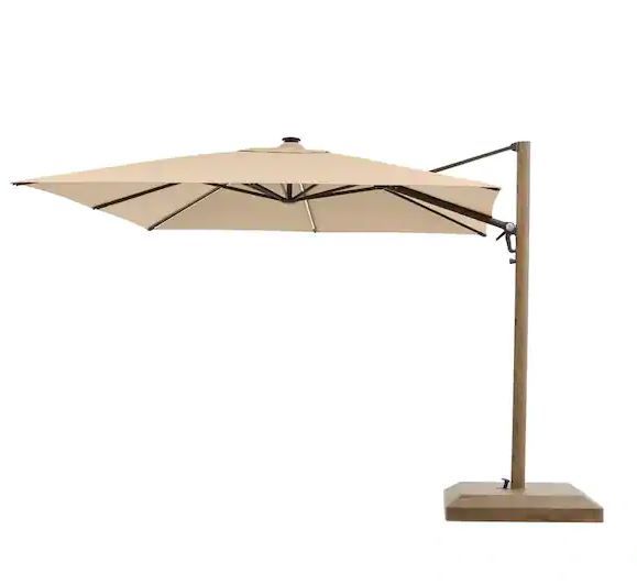 Photo 1 of 10 ft. Aluminum and Steel Cantilever LED Outdoor Patio Umbrella in Sunbrella Antique Beige with Metal Covered Base