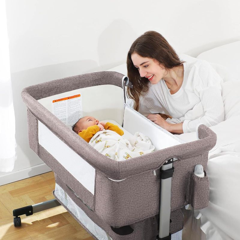 Photo 1 of Baby Bassinet Bedside Sleeper, Baby Bed Side Crib with Storage Basket, Easy Folding Bassinets, Adjustable Baby Bed for Infant Newborn.