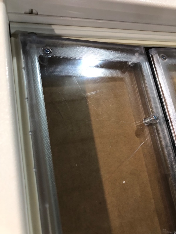 Photo 1 of ***USED - SCRATCHED AND SCRAPED - LIKELY MISSING PARTS - UNABLE TO VERIFY FUNCTIONALITY***
Ideal Pet Products VPPA Vinyl Patio Pet Door with Air Seal, Adjustable Height: 76-3/4" To 78-1/2", Extra Large, 10-1/4" x 15-3/4" Flap Size