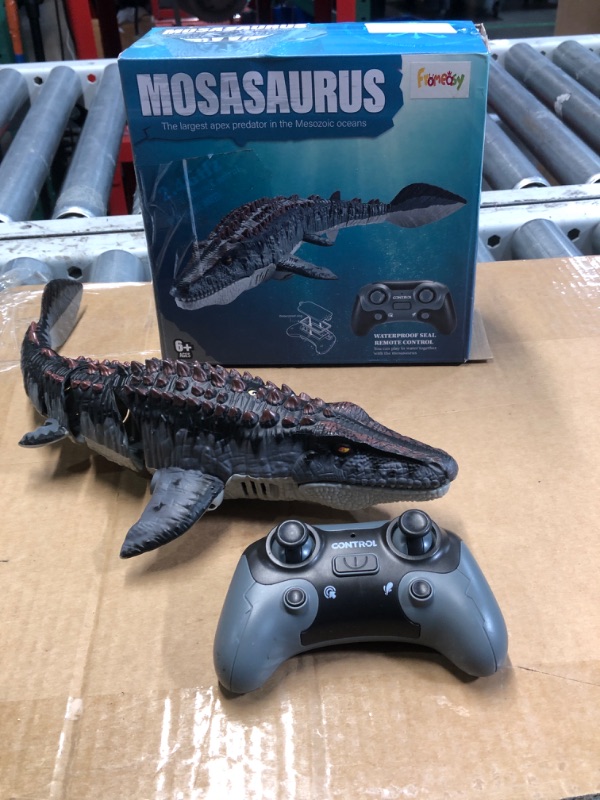 Photo 2 of ***MISSING BATTERY CHARGER***
fromeasy Mosasaurus Dinosaur Toys, Upgrade Remote Control Water Toy, Pool Toys for Kids Ages 4-8, RC Dino with Light and Spray Water for Swimming Bath Lake Ocean Christmas Birthday Gift