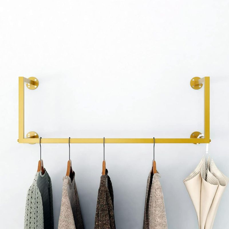 Photo 1 of HOMEKAYT Gold Clothing Rack,Wall-Mounted Clothes Rack,Modern Clothes Hanging Bar Space-Saving, Vintage Retail Garment Rack
