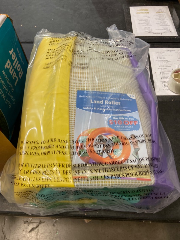 Photo 2 of HearthSong Roll with It! 2.0 Giant Inflatable Rainbow Land Roller with Mesh Interior for Active Outdoor Play, 67" Outer Diam. x 45" Inner Diam., Holds up to 300 lbs.