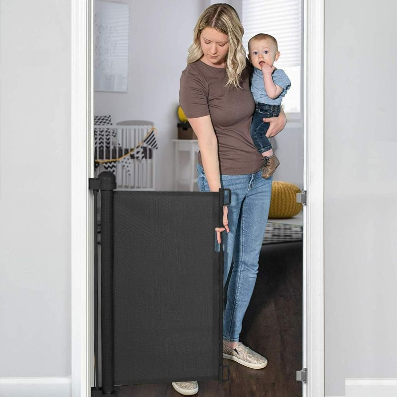 Photo 1 of YOOFOR Retractable Baby Gate, Extra Wide Safety Kids or Pets Gate, 33” Tall, Extends to 55” Wide, Mesh Safety Dog Gate for Stairs, Indoor, Outdoor, Doorways, Hallways (Black, 33"x55")
