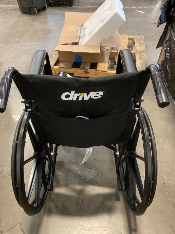 Photo 3 of Drive Medical SSP118FA-SF Silver Sport 1 Folding Transport Wheelchair with Full Arms and Removable Swing-Away Footrest, Black

