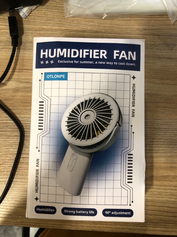 Photo 1 of Otlonpe Misting Fan Portable Fan with Mist,Small Handheld Fan 4000mAh Rechargeable Fan,Water Spray Hand Held Fan Battery Powered,Mister Hand Fan Cooling Personal Fan,Travel Indoor Outdoor Women Kids
